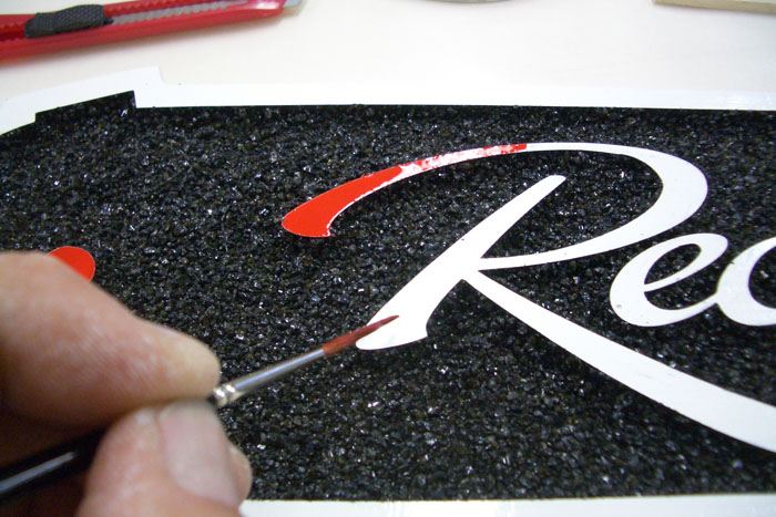 Painting the small lettering.jpg